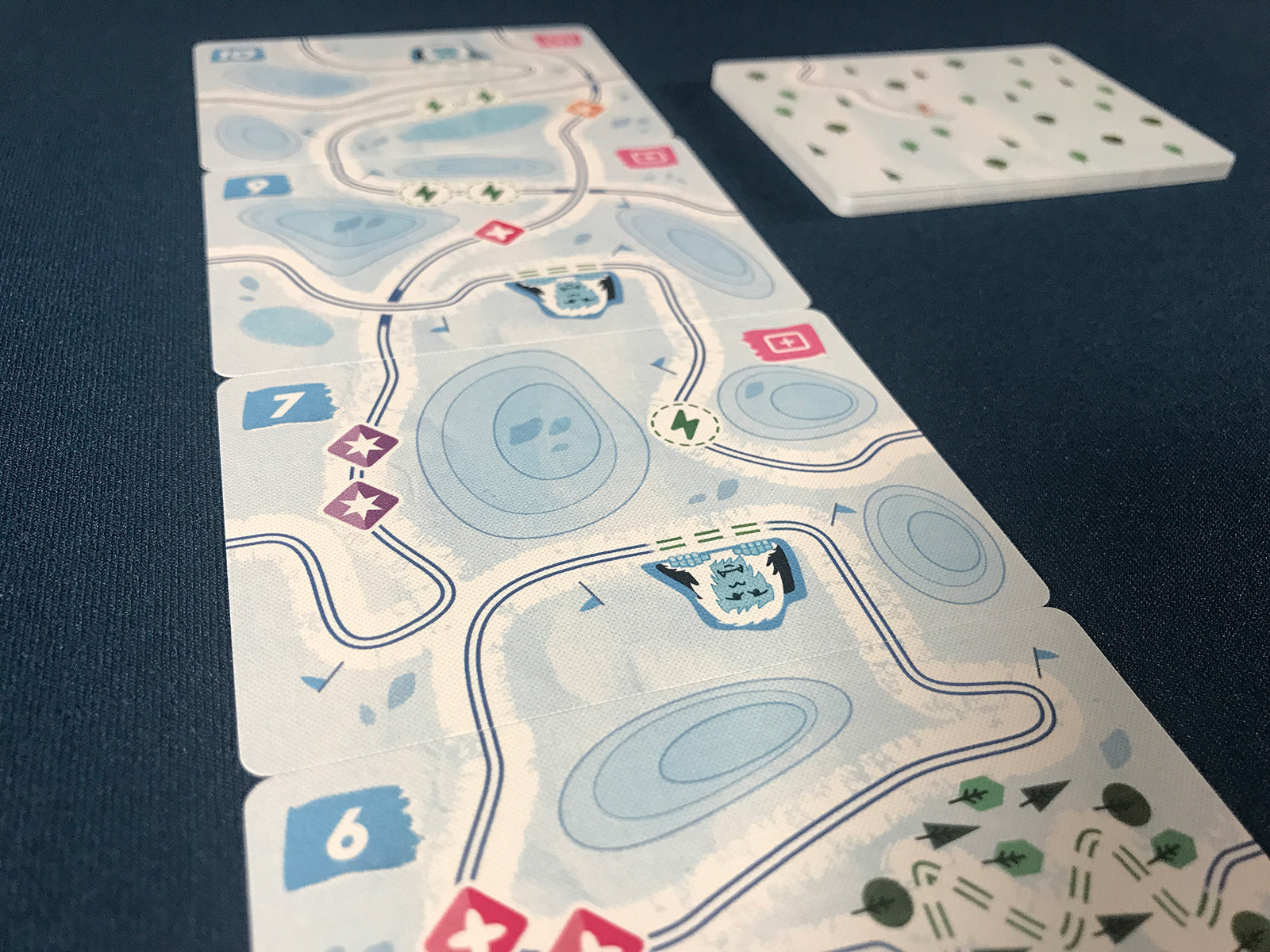 Tracing Mountain Paths to Choose Cards in the Market of Super Slopes